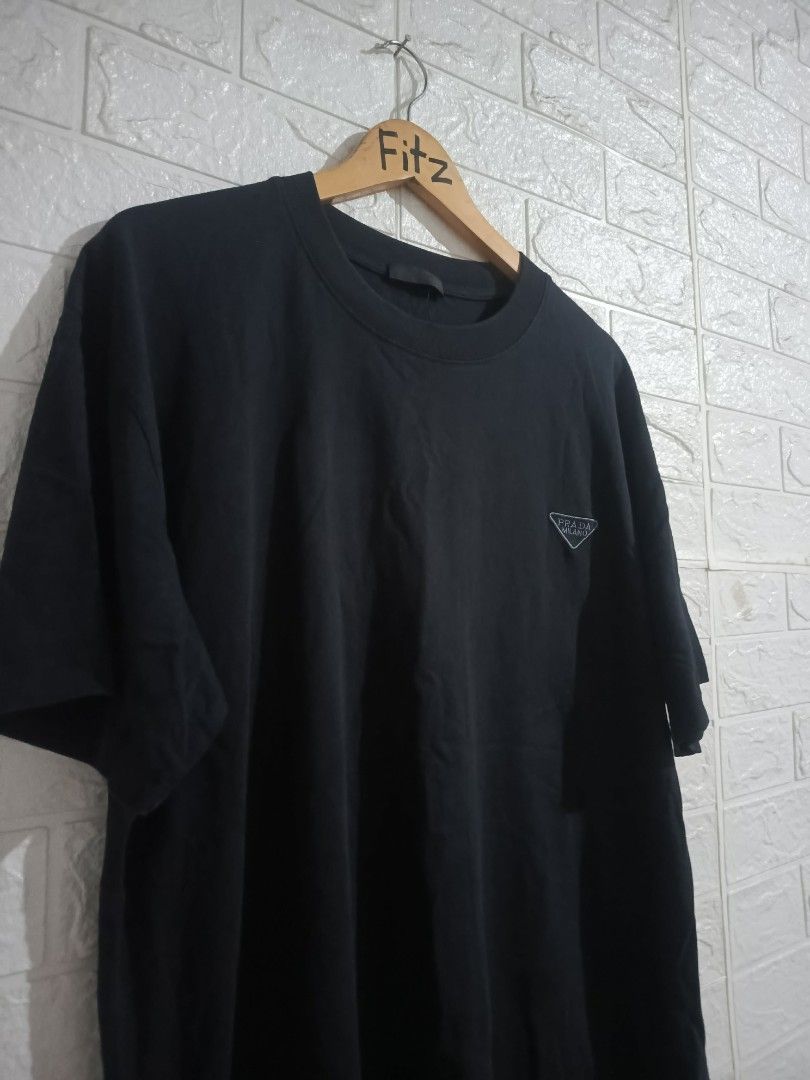 Prada Tshirt (Category: Luxury Apparel) located in Agoo. Submitted by fitzmatic15 (Listing ID 1462257085, Image 3). Description: Prada Tshirt XL 22x27.5 excellent condition napakasolid 🔥 pangit lang sa pic. 🔥.