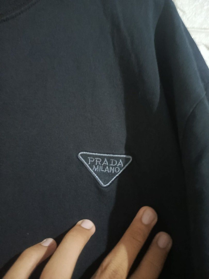 Prada Tshirt (Category: Luxury Apparel) located in Agoo. Submitted by fitzmatic15 (Listing ID 1462257085, Image 2). Description: Prada Tshirt XL 22x27.5 excellent condition napakasolid 🔥 pangit lang sa pic. 🔥.
