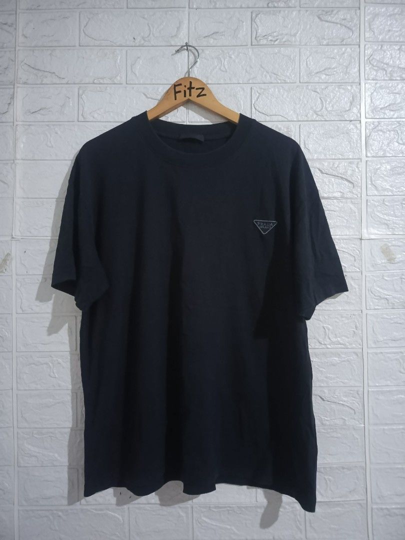 Prada Tshirt (Category: Luxury Apparel) located in Agoo. Submitted by fitzmatic15 (Listing ID 1462257085, Image 1). Description: Prada Tshirt XL 22x27.5 excellent condition napakasolid 🔥 pangit lang sa pic. 🔥.
