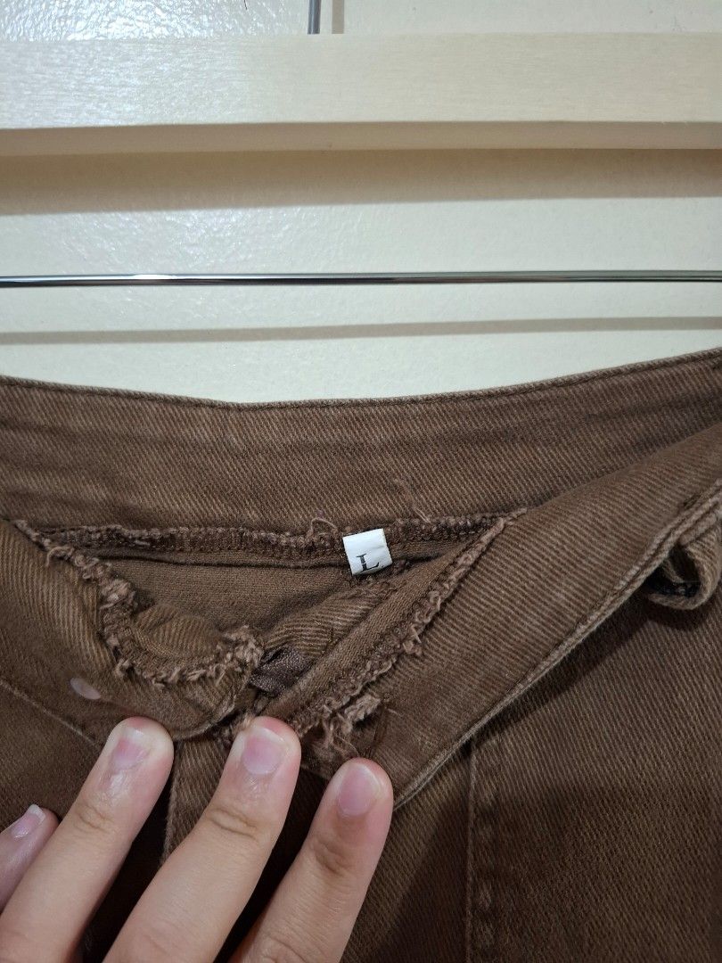 (Pre-loved) Skirt (Category: Skirts) located in Quezon City. Submitted by trendsbykikay (Listing ID 1462099685, Image 3). Description: Ready to wear skirt! di ko lang po na plantsa. size on tag is Large (semi-strechable) with slit at the back (see 2nd photo) 4-pocket.
