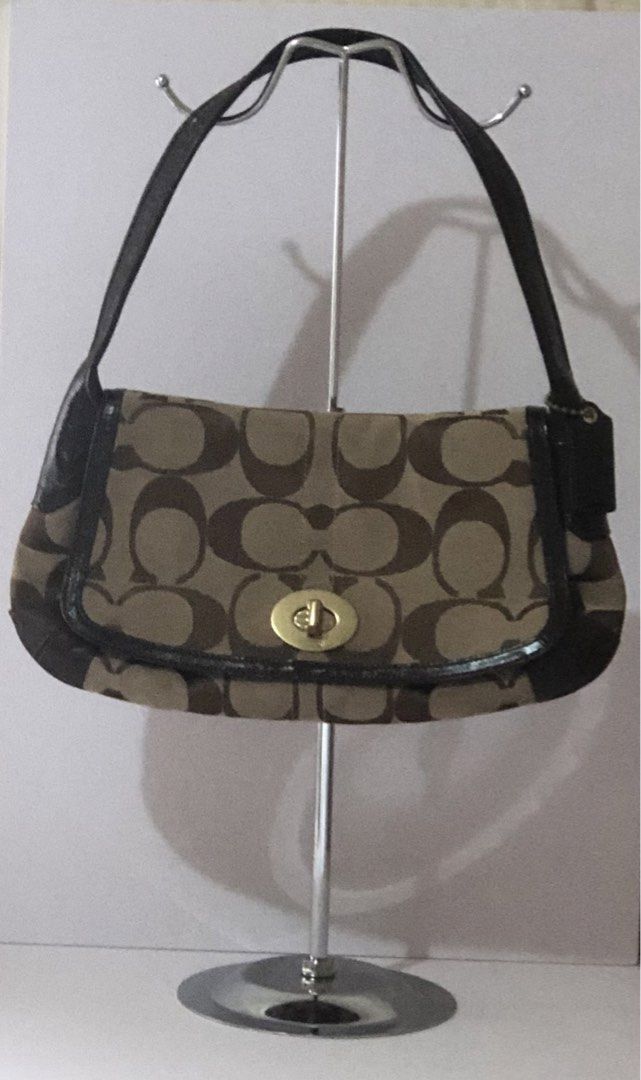 Pre-Owned Authentic Coach Shoulder Bag (Category: Shoulder Bags) located in Quezon City. Submitted by jingd (Listing ID 1462088669, Image 1). Description: - Pre-owned Coach shoulder bag - Iconic monogram jacquard canvas in brown and khaki - Genuine leather trim and strap - Secure gold-tone turnlock closure - With exterior pocket, zipper interior pocket and 2 slip pockets - Video showcasing the details will be posted on our IG page.