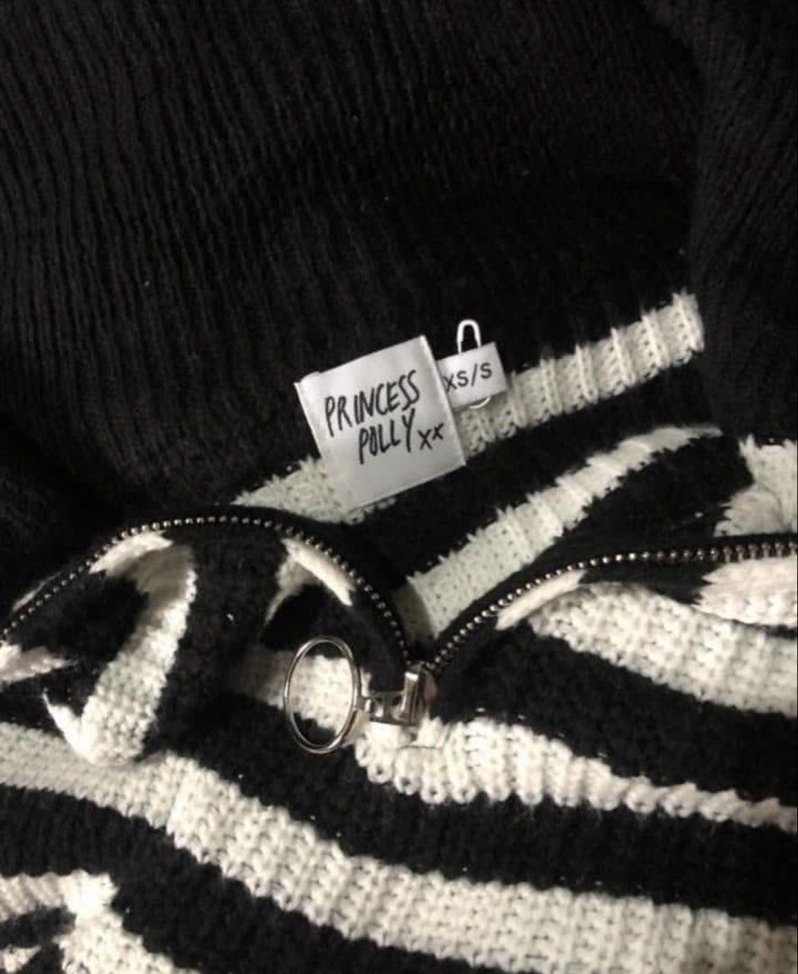 Princess Polly Oversized Zipup Knitted Sweater (Category: Coats, Jackets and Outerwear) located in Binan City. Submitted by myprelovedhaul (Listing ID 1462065296, Image 3). Description: The item in the selected region is a black and white striped quarter-zip knit sweater from the fashion brand Princess Polly. It features a chunky ribbed texture, a prominent black spread collar, drop shoulders, and a silver ring-pull zipper closure..