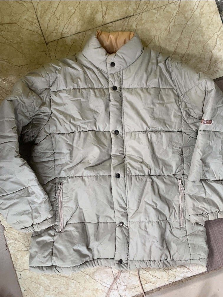 Puffer Jacket (Category: Coats, Jackets and Outerwear) located in Quezon City. Submitted by chic.on.a.dime (Listing ID 1462065618, Image 1). Description: - Classic Sport puffer jacket - UNISEX - Beige color with tan lining - Full zip and button closure - two way lock, zipper and snap button - Two front zip pockets - Ideal for staying warm - medium to large size but can fit to large NOTE: MANAGE YOUR EXPECTATIONS ‼️📢 - color may vary due to light