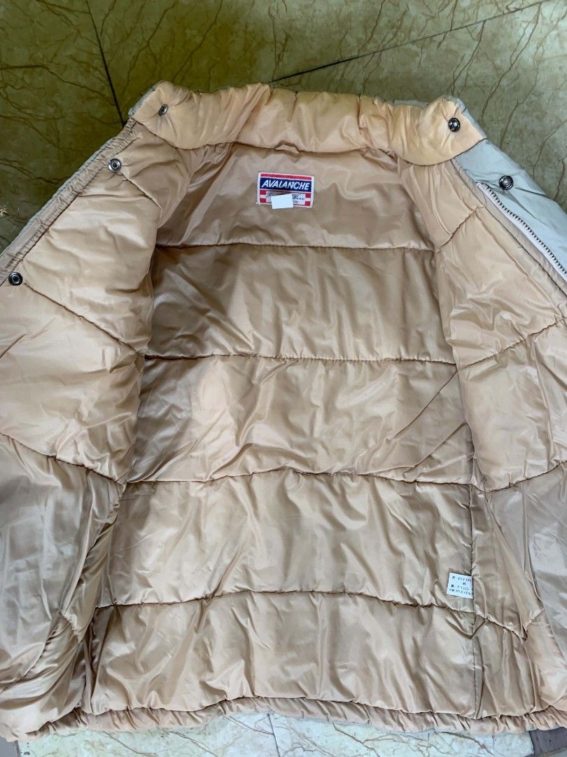 Puffer Jacket (Category: Coats, Jackets and Outerwear) located in Quezon City. Submitted by chic.on.a.dime (Listing ID 1462065618, Image 3). Description: - Classic Sport puffer jacket - UNISEX - Beige color with tan lining - Full zip and button closure - two way lock, zipper and snap button - Two front zip pockets - Ideal for staying warm - medium to large size but can fit to large NOTE: MANAGE YOUR EXPECTATIONS ‼️📢 - color may vary due to light