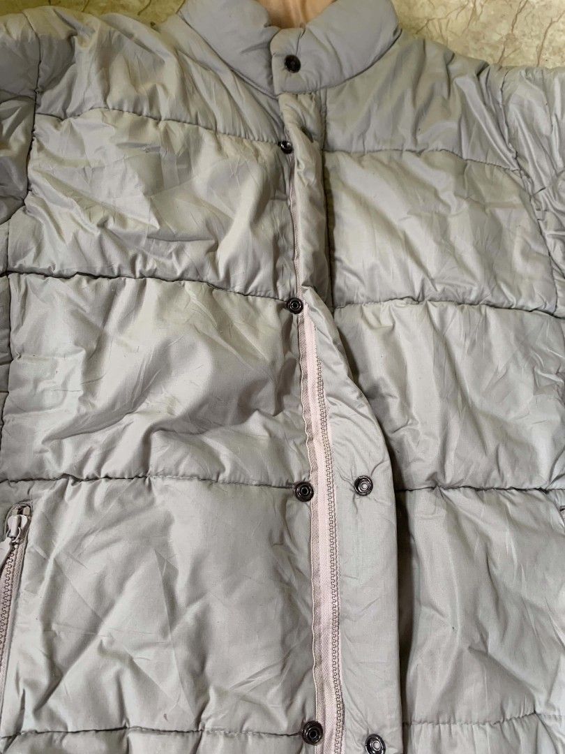 Puffer Jacket (Category: Coats, Jackets and Outerwear) located in Quezon City. Submitted by chic.on.a.dime (Listing ID 1462065618, Image 2). Description: - Classic Sport puffer jacket - UNISEX - Beige color with tan lining - Full zip and button closure - two way lock, zipper and snap button - Two front zip pockets - Ideal for staying warm - medium to large size but can fit to large NOTE: MANAGE YOUR EXPECTATIONS ‼️📢 - color may vary due to light