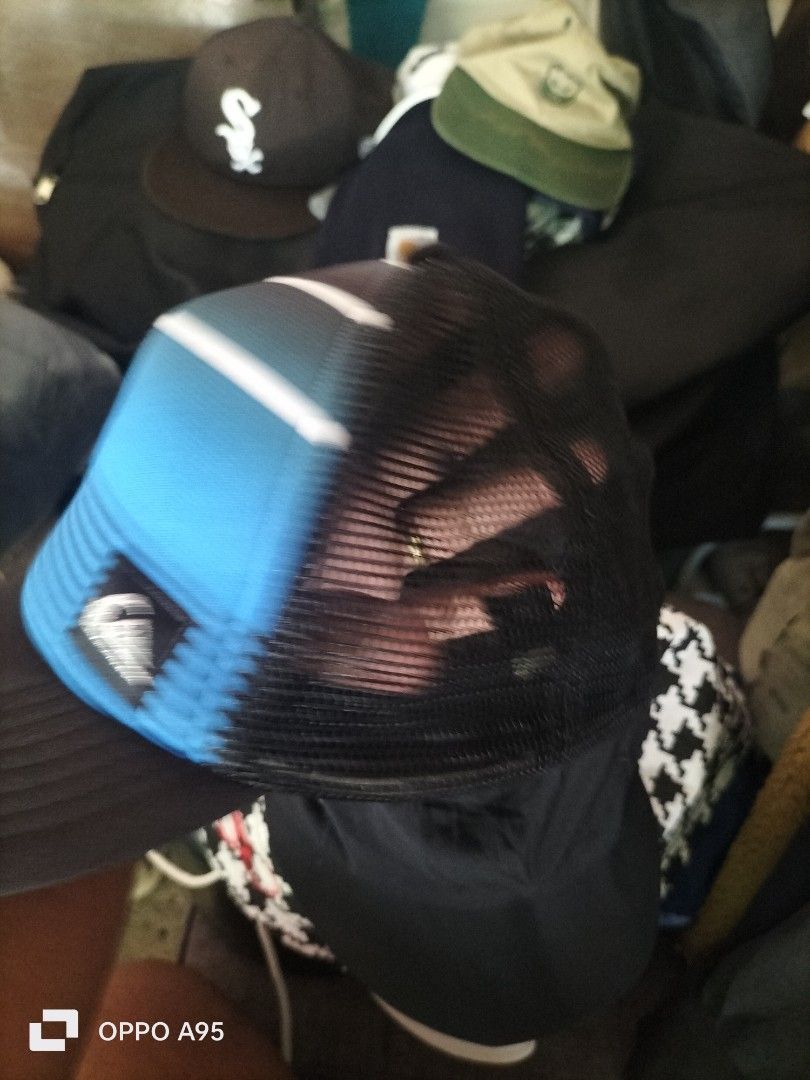Quiksilver Trucker Cap Blue Black Mesh Snapback (Category: Caps & Hats) located in Baler. Submitted by jaydeebaltazar (Listing ID 1462162413, Image 3). Description: - Brand: Quiksilver - Style: Trucker Cap - Color: Blue and black with white stripes - Features: Mesh back for breathability, adjustable snapback closure - Size: 55cm - Ideal for: Sunny days, casual wear.