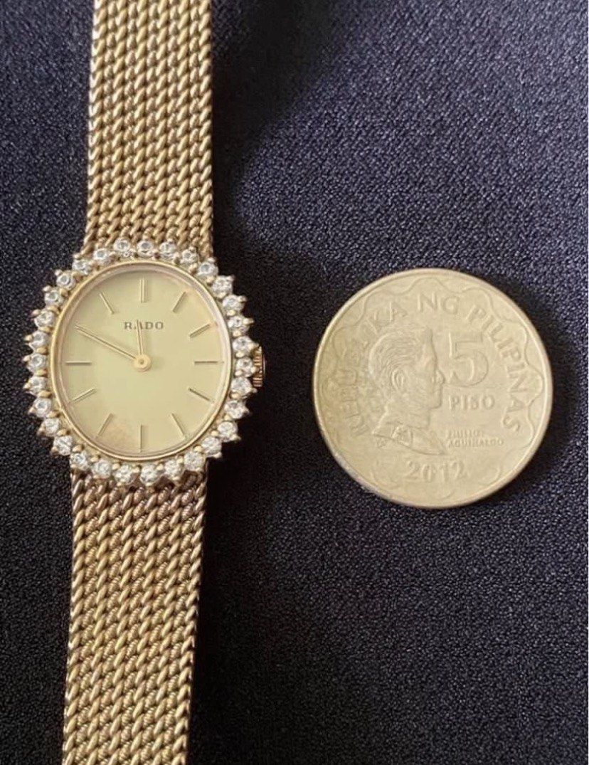 Rado Gold Tone Diamond Bezel Watch (Category: Women's Watches) located in Muntinlupa City. Submitted by bloo_berry (Listing ID 1462147772, Image 2). Description: - Vintage Rado Watch - Oval Face - Diamond Bezel - Gold Tone Mesh Strap - Model Number: 332.7757.2 - Serial Number: 15600373 - manual wind - Bracelet approximately 6 inches ₱26,850 Selling as is. This is a vintage watch from my personal collection and may no longer tell accurate time. Pl
