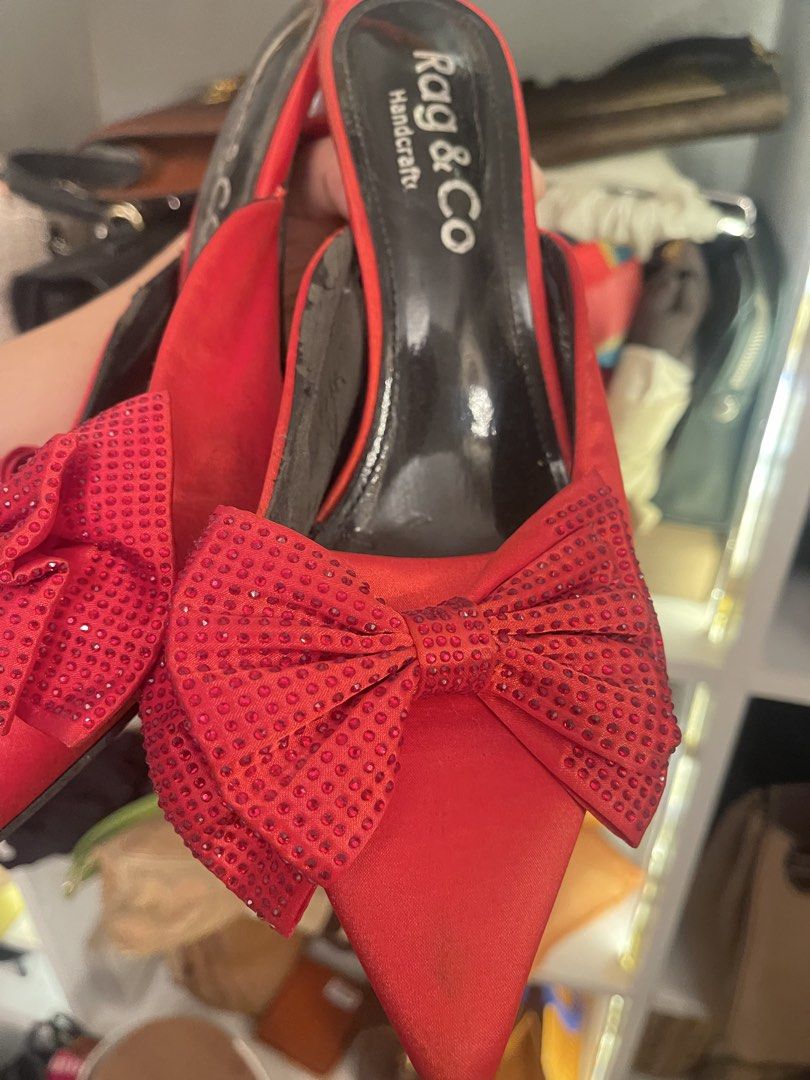 Rag & Co Red Bow Heels (Category: Heels) located in Marilao. Submitted by wardrovearchives (Listing ID 1462204390, Image 3). Description: - Brand: Rag & Co. - Color: Red - Style: Pointed toe, slip-on heels - Features: Sparkly bows on the front - Heel Height: Comfortable - Occasion: Great for dressing up any outfit.