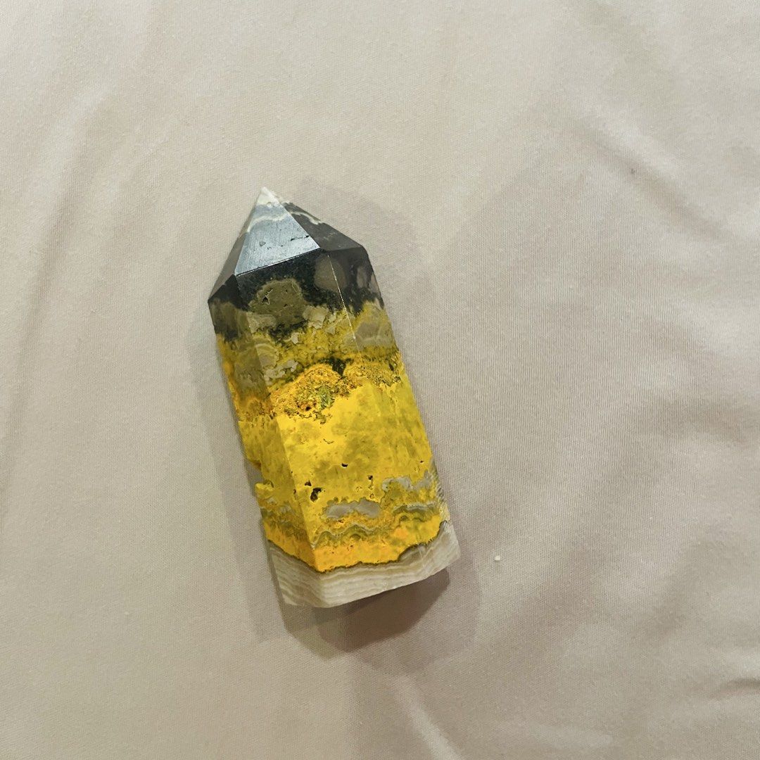 Rare! Authentic Bumblebee Jasper Crystal Point Tower (Category: Other Home Decor) located in Quezon City. Submitted by travelstylelove (Listing ID 1462103191, Image 1). Description: Eye-catching polished crystal tower featuring stunning natural yellow, black, cream, and gray patterns that resemble a miniature landscape. The vibrant golden-yellow tones contrast beautifully with the darker upper section, making this a striking display piece for a d