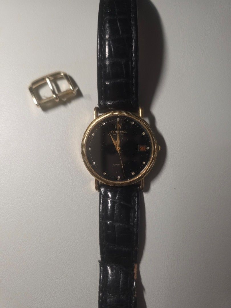 RAYMOND WEIL GENEVE Automatic Watch (Category: Men's Watches) located in Manila. Submitted by dcory (Listing ID 1462161959, Image 2). Description: Issues: - It is not working despite the watch having an automatic movement, so there is probably an issue with the watch's mechanism. - Strap of the watch is not in good condition - Selling it as is.