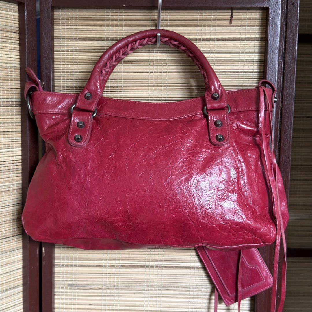Red balenciaga first bag (Category: Luxury Bags & Wallets) located in Taguig. Submitted by chic.botique (Listing ID 1462196191, Image 3). Description: .