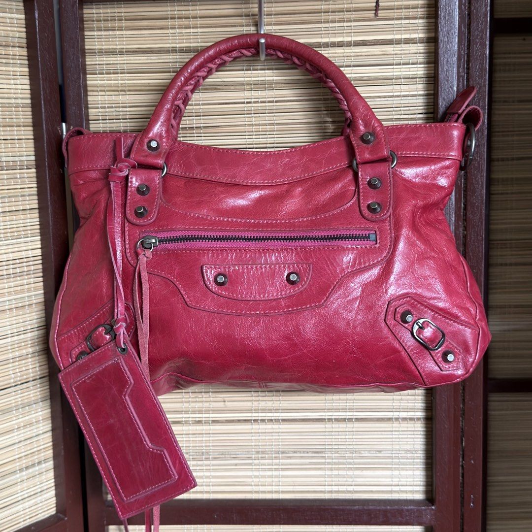 Red balenciaga first bag (Category: Luxury Bags & Wallets) located in Taguig. Submitted by chic.botique (Listing ID 1462196191, Image 1). Description: .