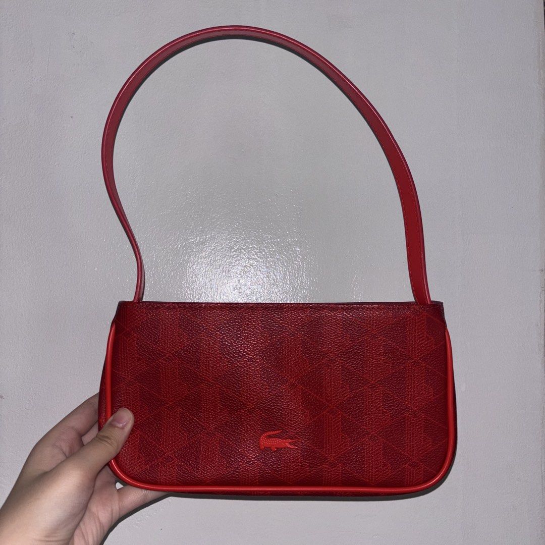 Red Lacoste Shoulder Bag (Category: Shoulder Bags) located in Pasig City. Submitted by prel0vedbysea (Listing ID 1460186010, Image 1). Description: ⟢ Lacoste Red Shoulder Bag — with minor strap dents from scratch — rfs: decluterring — loc: buting pasig city * mod: ssd.