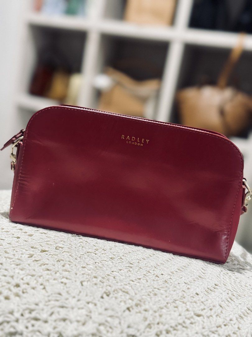 Radley London Kili Bag (Category: Cross-body Bags) located in Bacolod City. Submitted by vintage_vogue6100 (Listing ID 1462139306, Image 1). Description: - Genuine red leather crossbody bag - Elegant gold hardware details - Secure zip closure - Adorable heart charm on the zipper pull - Versatile for everyday wear or a night out - Spacious interior to hold all your essentials.