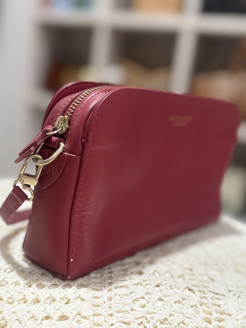 Radley London Kili Bag (Category: Cross-body Bags) located in Bacolod City. Submitted by vintage_vogue6100 (Listing ID 1462139306, Image 2). Description: - Genuine red leather crossbody bag - Elegant gold hardware details - Secure zip closure - Adorable heart charm on the zipper pull - Versatile for everyday wear or a night out - Spacious interior to hold all your essentials.