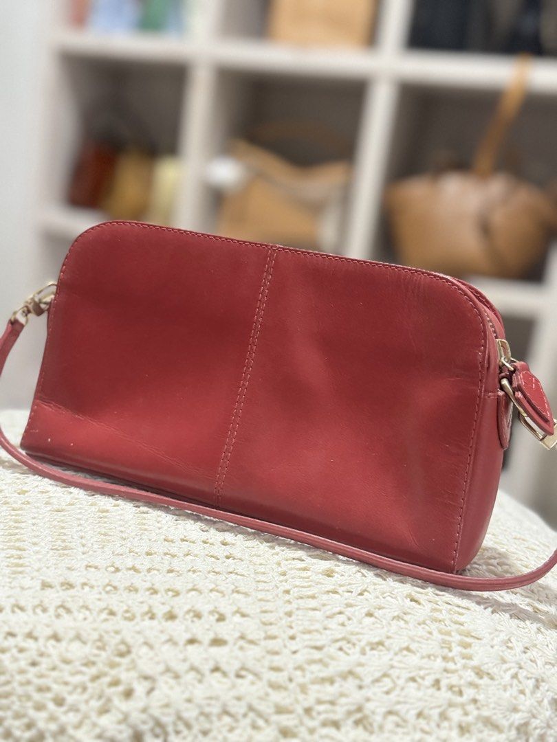Radley London Kili Bag (Category: Cross-body Bags) located in Bacolod City. Submitted by vintage_vogue6100 (Listing ID 1462139306, Image 3). Description: - Genuine red leather crossbody bag - Elegant gold hardware details - Secure zip closure - Adorable heart charm on the zipper pull - Versatile for everyday wear or a night out - Spacious interior to hold all your essentials.