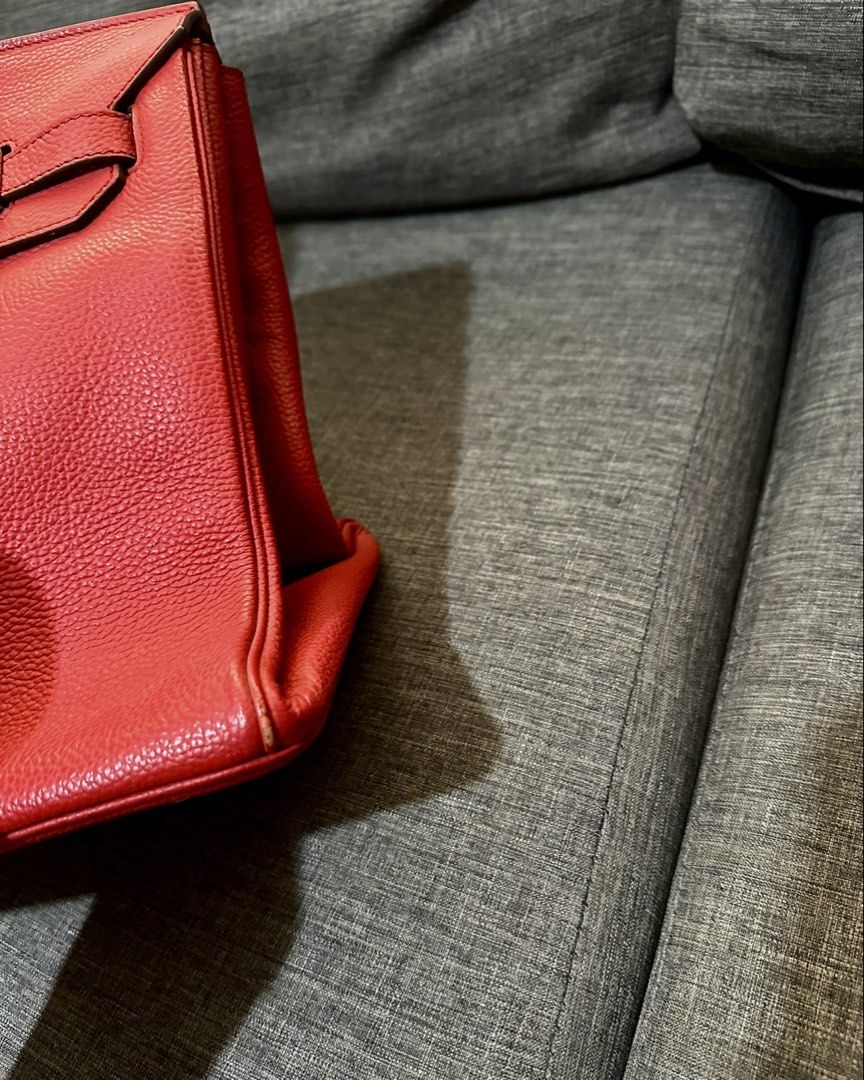 Red Leather Top Handle Bag (Category: Luxury Bags & Wallets) located in Manila. Submitted by luxuryjuly (Listing ID 1462045025, Image 2). Description: - Classic red leather handbag - Textured finish - Top handles - Structured shape - Metal hardware details - Spacious interior - Versatile for daily use or special occasions - Timeless piece.