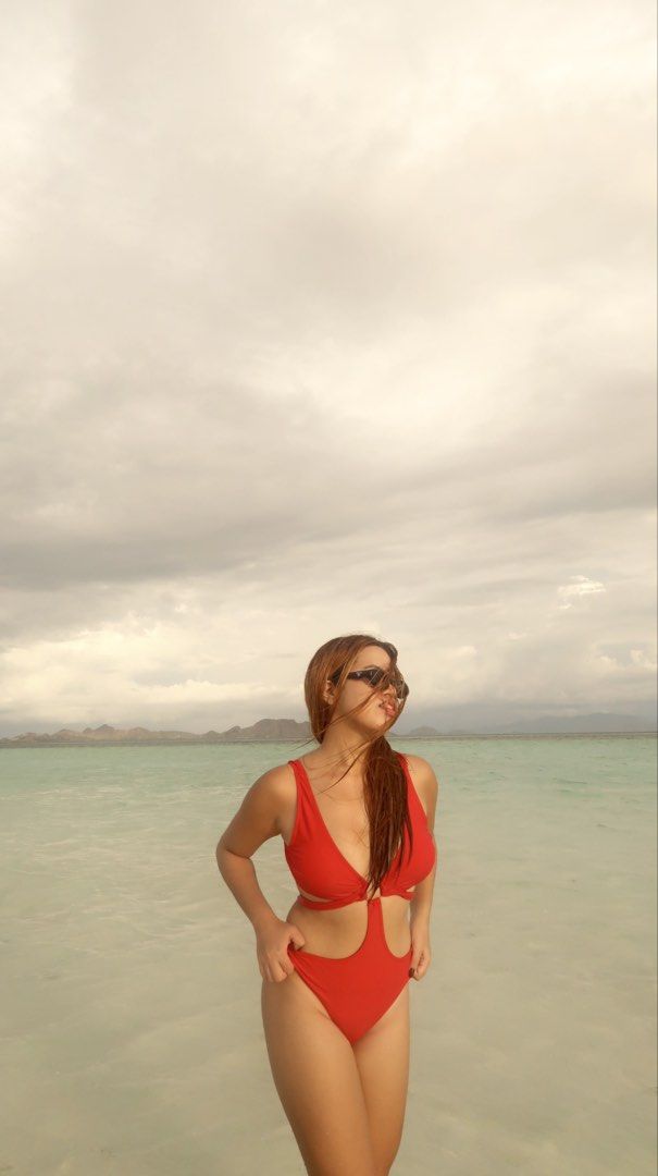 Red One-Piece Swimsuit with Cut-outs (Category: Bikinis & Swimsuits) located in Manila. Submitted by jminacraf26908 (Listing ID 1462216004, Image 3). Description: - Stylish red one-piece swimsuit - Features trendy side cut-out details - Chic ring accent at the bust - Ideal for beach days and pool parties - Comfortable and fashionable design for summer.
