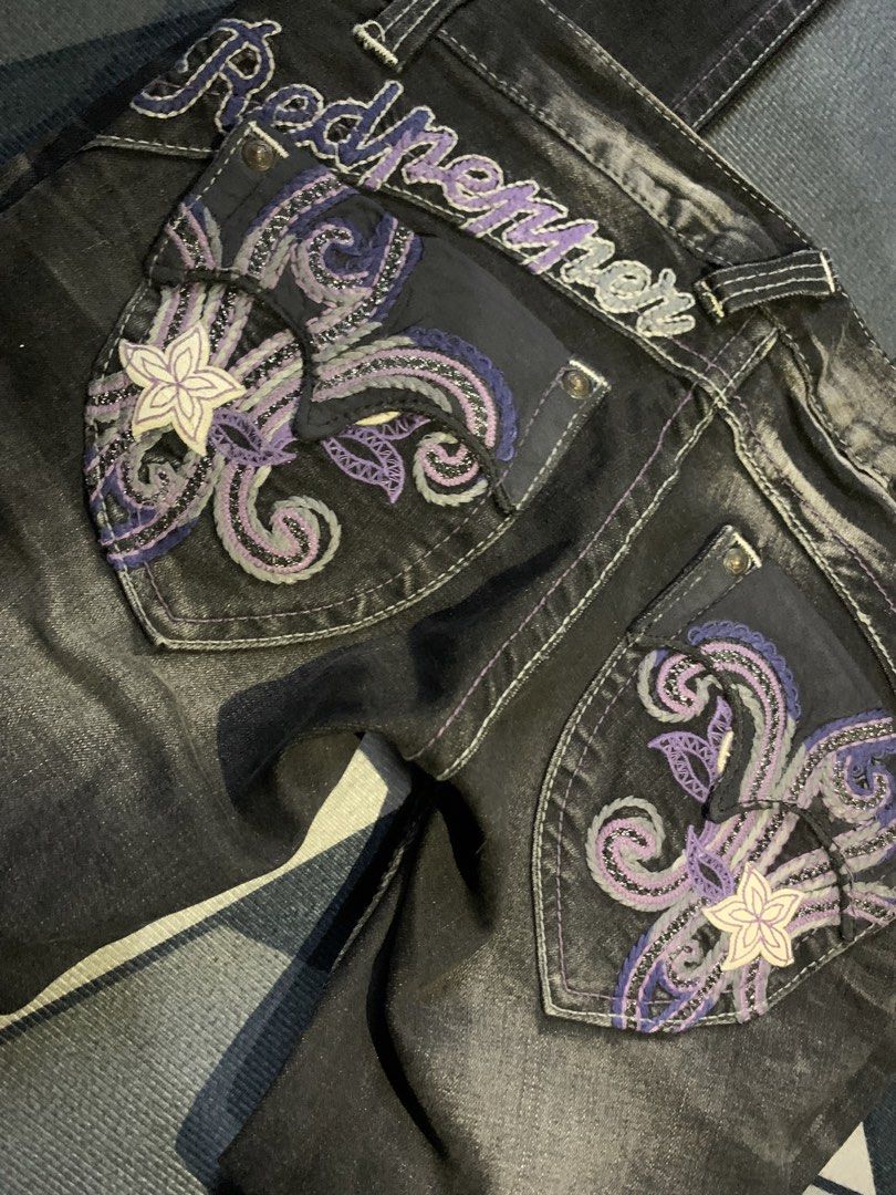 Red Pepper Black Embellished Jeans (Category: Jeans) located in Cebu City. Submitted by selamethrift (Listing ID 1462148701, Image 2). Description: - Brand: Red Pepper - Color: Black Denim - Design: Intricate purple and white floral embroidery on back pockets - Details: Embroidered brand name on back waistband, white contrast stitching throughout - Closure: Button and zip front - Style: Statement piece -Size: 24 on tag -see last slide for minimal