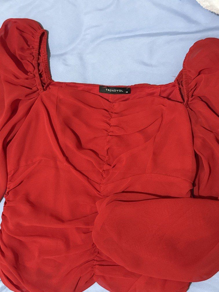 Red Trendyol Blouse (Category: Blouses) located in Manila. Submitted by jannine_closet (Listing ID 1462187085, Image 1). Description: With Stitching flaw at the back.