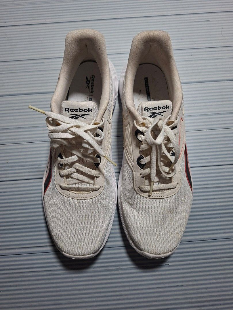 Reebok White Running Shoes (Category: Sneakers) located in Manila. Submitted by briannekevin (Listing ID 1462181975, Image 1). Description: - White Reebok running shoes - Breathable mesh upper - Secure lace-up closure - Durable rubber outsole for excellent grip - Versatile for workouts and casual wear - Clean and simple design.