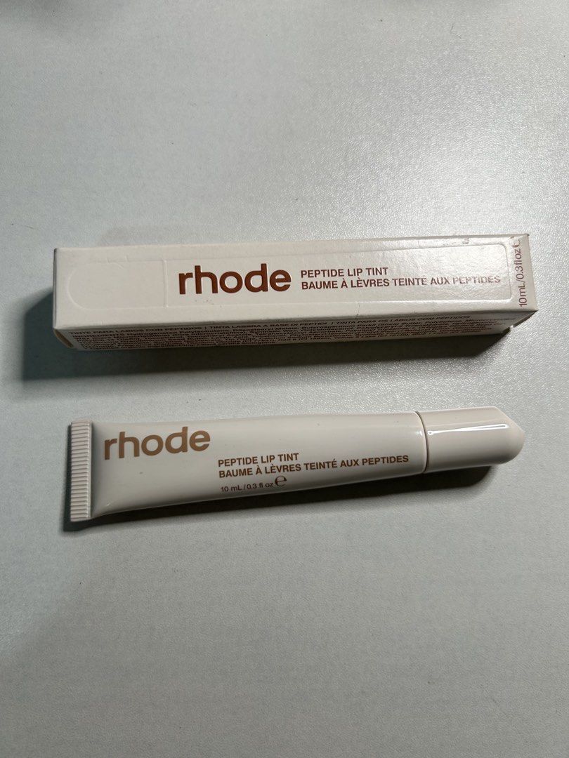 Rhode Peptide Lip Tint - Cinnamon Roll (Category: Makeup) located in Quezon City. Submitted by rhaez (Listing ID 1462193498, Image 1). Description: - Rhode Peptide Lip Tint - Shade: Cinnamon Roll - Sheer lip tint formula - Enriched with peptides - Made in Italy - Clean, minimalist packaging - Ideal for everyday wear.