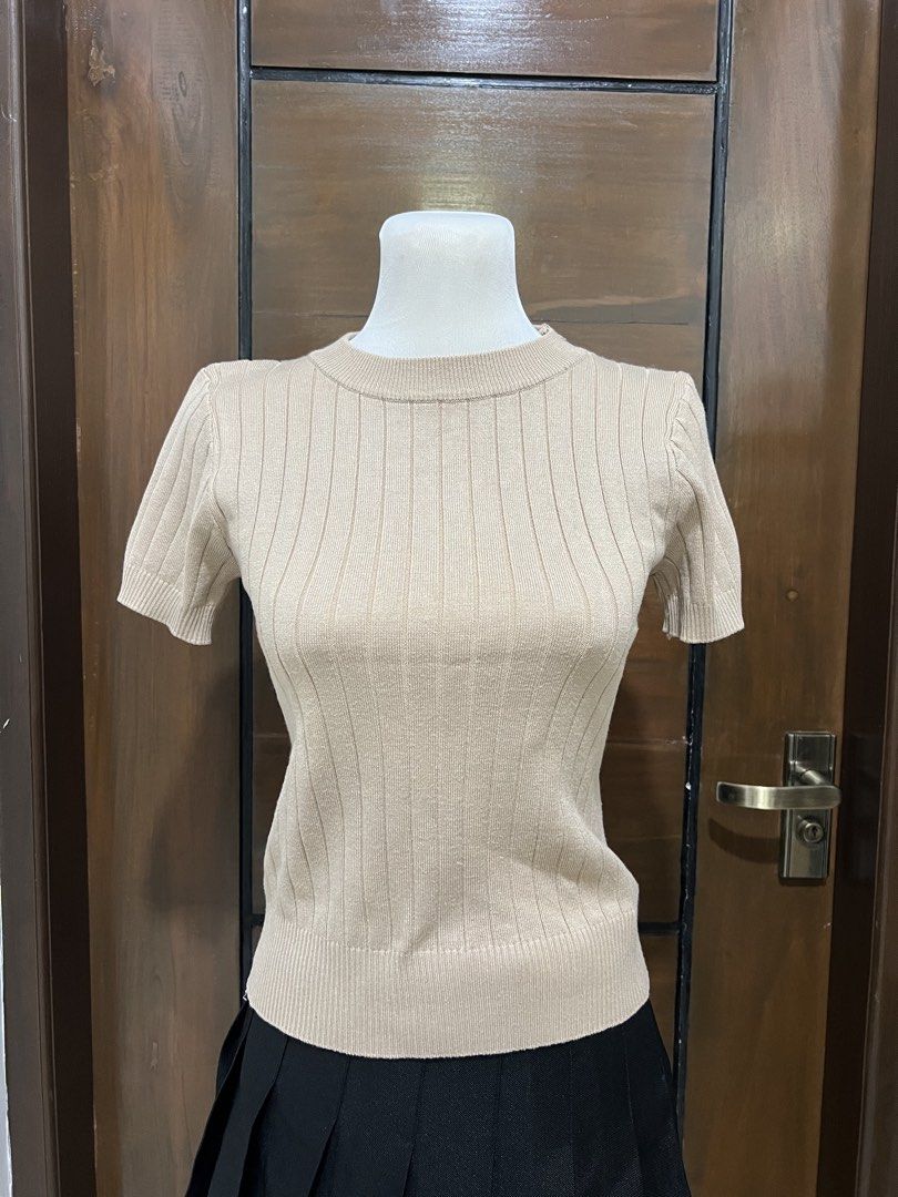 Ribbed Knit Short Sleeve Top - Beige (Category: Blouses) located in Angat. Submitted by yanacruise (Listing ID 1462052165, Image 2). Description: - Simple beige knit top - Short sleeves - Crew neck - All-over ribbed texture - Versatile: pairs well with skirts or pants - Easy to style for casual or dressier occasions.