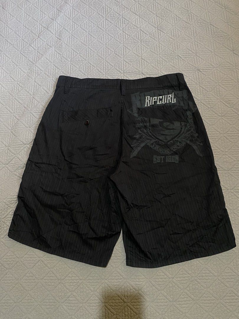 Ripcurl Striped Shorts Size 34 (Category: Shorts) located in Manila. Submitted by clark_thrift (Listing ID 1462247647, Image 1). Description: - Black Ripcurl shorts - Pinstripe detail - Ripcurl logo and 'Est 1969' graphic on back - 'Live The Search' slogan on waistband - Size 34 - Ideal for casual wear or beach days.