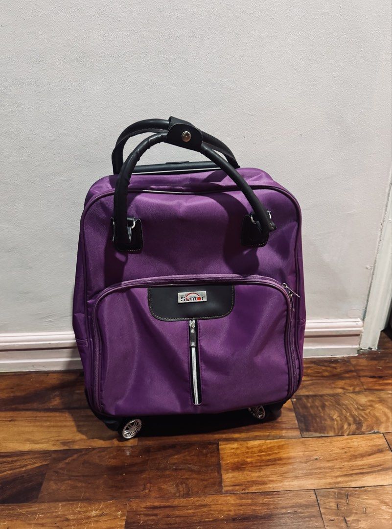 Rolling Luggage - Medium Size (Category: Looking For) located in Quezon City. Submitted by gcc216 (Listing ID 1462099166, Image 3). Description: - Vibrant purple Samer rolling luggage - Medium size: 38cm (L) x 20cm (W) x 43cm (H) - Smooth-360° rolling wheels for easy maneuverability - Pull Rod - Comfortable handles - Oxford Cloth - Water Resistant - Ideal for trips or everyday use -also ideal for shopping - Original price is 2,968. - Used only on