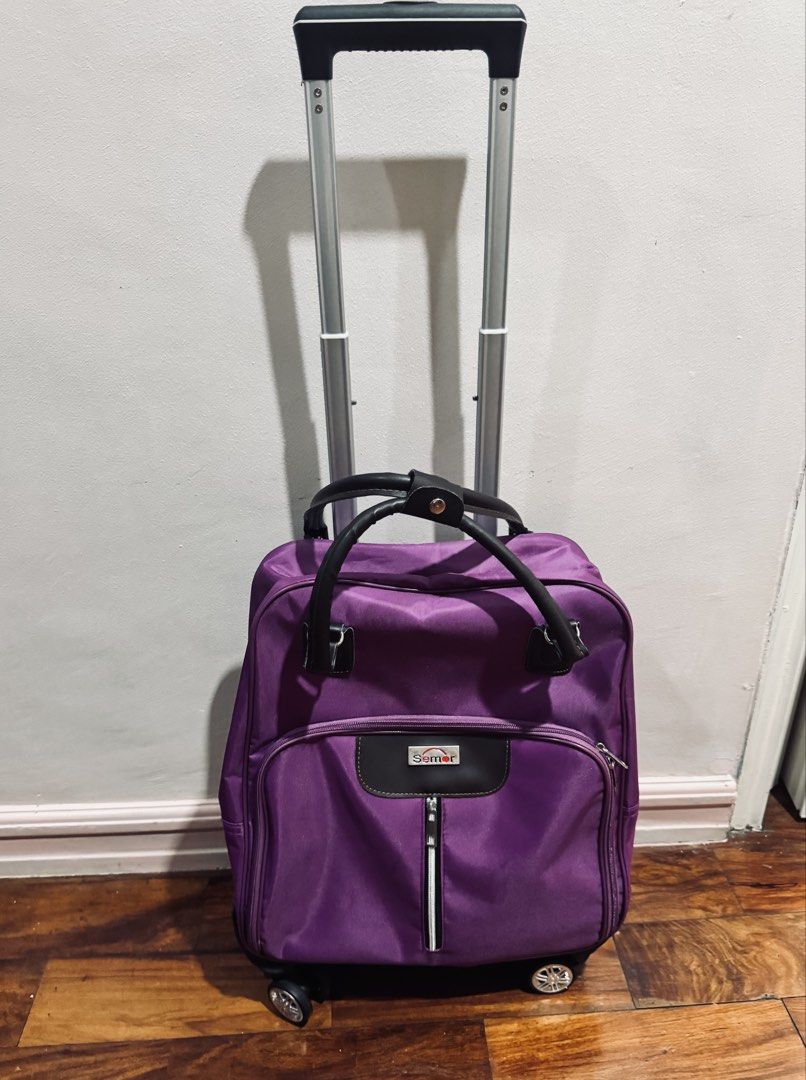 Rolling Luggage - Medium Size (Category: Looking For) located in Quezon City. Submitted by gcc216 (Listing ID 1462099166, Image 2). Description: - Vibrant purple Samer rolling luggage - Medium size: 38cm (L) x 20cm (W) x 43cm (H) - Smooth-360° rolling wheels for easy maneuverability - Pull Rod - Comfortable handles - Oxford Cloth - Water Resistant - Ideal for trips or everyday use -also ideal for shopping - Original price is 2,968. - Used only on