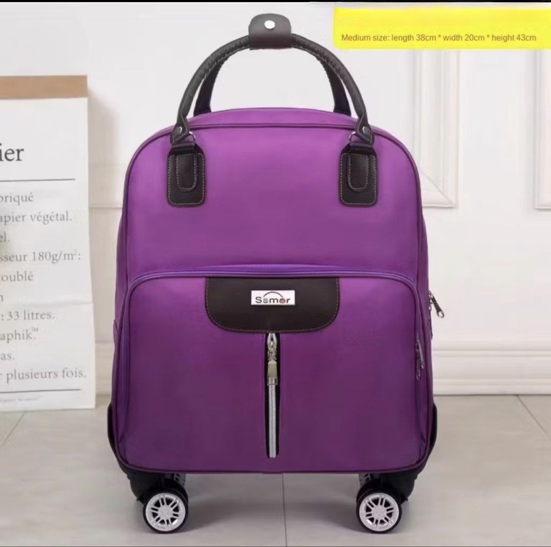 Rolling Luggage - Medium Size (Category: Looking For) located in Quezon City. Submitted by gcc216 (Listing ID 1462099166, Image 1). Description: - Vibrant purple Samer rolling luggage - Medium size: 38cm (L) x 20cm (W) x 43cm (H) - Smooth-360° rolling wheels for easy maneuverability - Pull Rod - Comfortable handles - Oxford Cloth - Water Resistant - Ideal for trips or everyday use -also ideal for shopping - Original price is 2,968. - Used only on