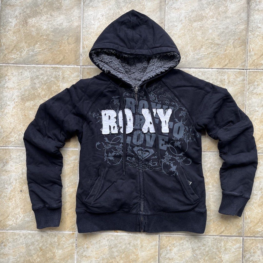 Roxy Dare to Love Reversible Lined Zip Up Hoodie (Category: Coats, Jackets and Outerwear) located in Quezon City. Submitted by chikinita (Listing ID 1462091925, Image 1). Description: -Heavyweight - Black Roxy hoodie - Sherpa-lined hood for extra warmth - Features Roxy logo and floral graphic on the front - Full zip closure with durable YKK zipper - Adjustable drawstrings for the hood - Convenient front pockets - Ideal for staying warm and stylis