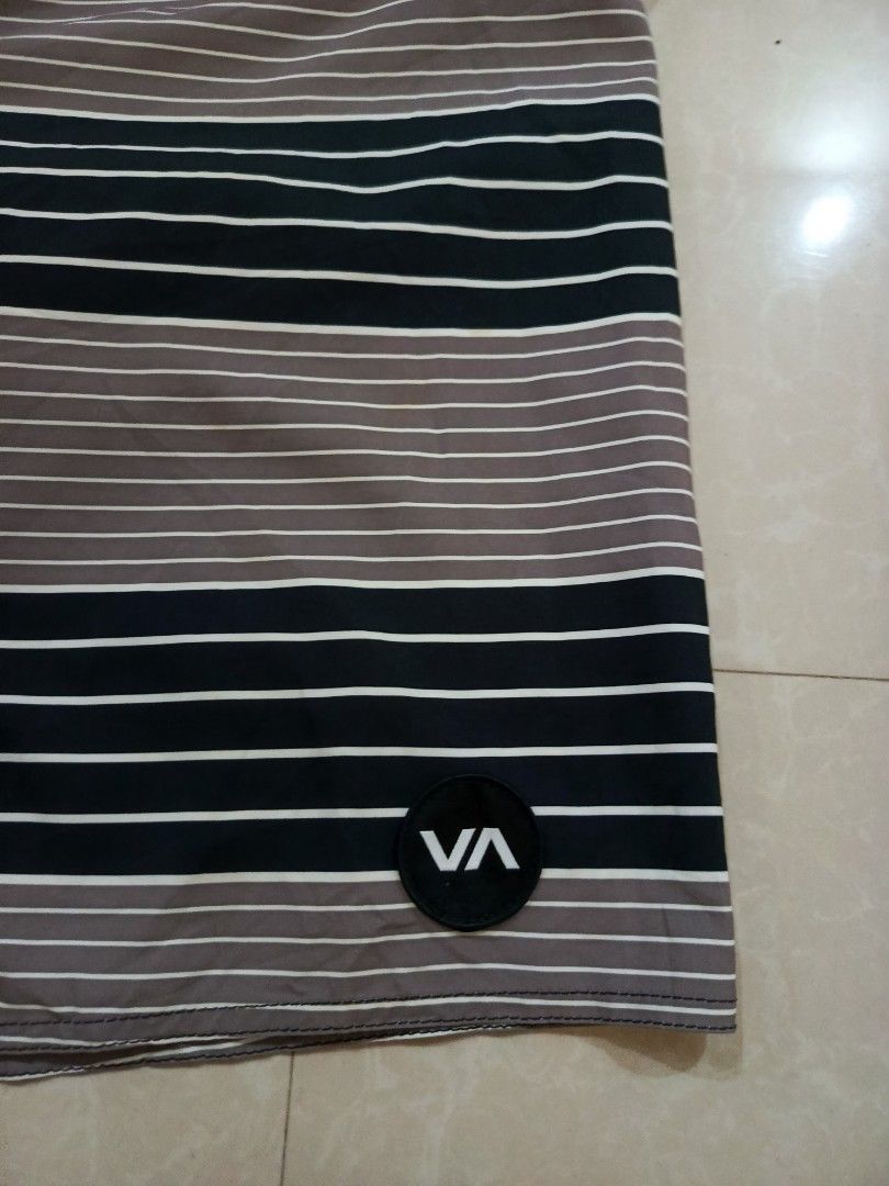 RVCA Industry Board Shorts Size 36 Striped (Category: Shorts) located in Cabatuan. Submitted by penthegreat (Listing ID 1462109571, Image 2). Description: - RVCA Industry board shorts - Size: 36 - Color: Black, grey, and white stripe pattern - Features a black back pocket with velcro closure - Drawstring waist for adjustable and secure fit - Ideal for swimming, surfing, or casual everyday wear.