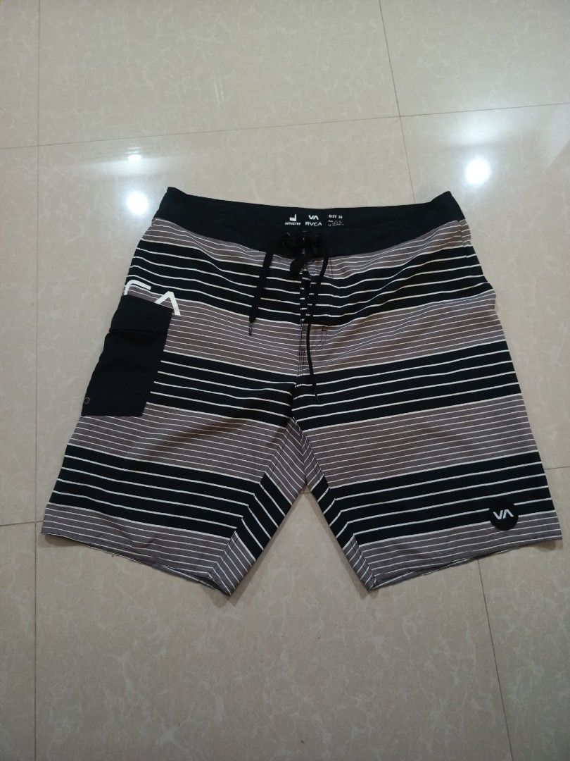 RVCA Industry Board Shorts Size 36 Striped (Category: Shorts) located in Cabatuan. Submitted by penthegreat (Listing ID 1462109571, Image 1). Description: - RVCA Industry board shorts - Size: 36 - Color: Black, grey, and white stripe pattern - Features a black back pocket with velcro closure - Drawstring waist for adjustable and secure fit - Ideal for swimming, surfing, or casual everyday wear.