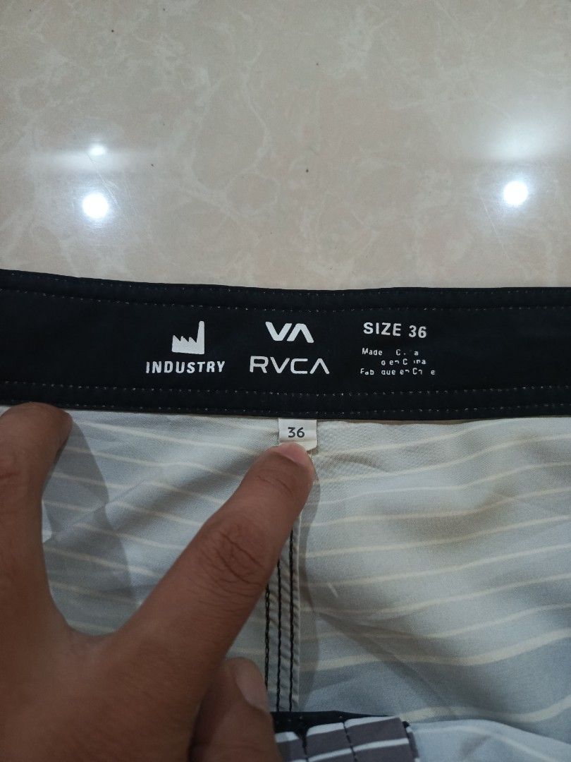 RVCA Industry Board Shorts Size 36 Striped (Category: Shorts) located in Cabatuan. Submitted by penthegreat (Listing ID 1462109571, Image 3). Description: - RVCA Industry board shorts - Size: 36 - Color: Black, grey, and white stripe pattern - Features a black back pocket with velcro closure - Drawstring waist for adjustable and secure fit - Ideal for swimming, surfing, or casual everyday wear.