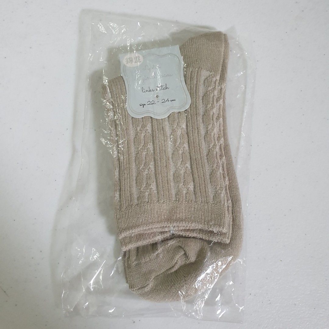 Sage green Cable Knit Socks (Category: Socks & Tights) located in Paranaque City. Submitted by cobien (Listing ID 1462165491, Image 1). Description: - Beige cable knit socks - Designed for women - Size: 22-24cm - Material: Polyester - Brand new in original packaging - Ideal for everyday wear.