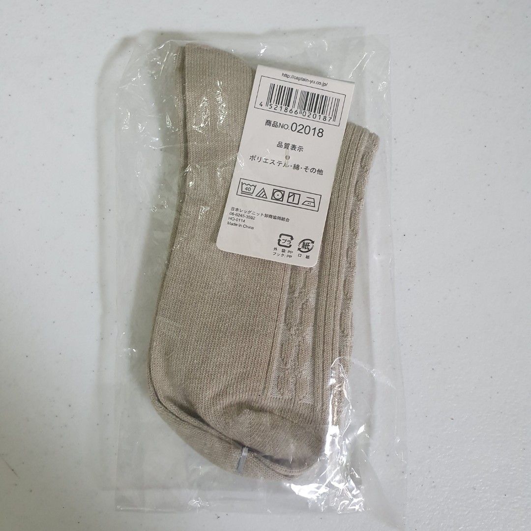 Sage green Cable Knit Socks (Category: Socks & Tights) located in Paranaque City. Submitted by cobien (Listing ID 1462165491, Image 2). Description: - Beige cable knit socks - Designed for women - Size: 22-24cm - Material: Polyester - Brand new in original packaging - Ideal for everyday wear.