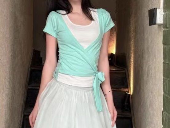 SAIGONESE (Vietnam) Mint Green Wrap Top with White Inner Layer (Category: Blouses) located in Cebu City. Submitted by moonglare.cebu (Listing ID 1462213709, Image 1). Description: - size medium to large Mint green wrap top - Includes a white inner layer - Ties at the side for adjustable fit - Comfortable and stylish design - Perfect for layering or wearing solo - Easily pairs with skirts or pants - Looks great with a white skirt.