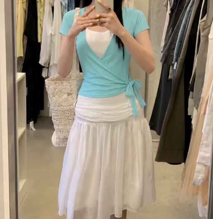 SAIGONESE (Vietnam) Mint Green Wrap Top with White Inner Layer (Category: Blouses) located in Cebu City. Submitted by moonglare.cebu (Listing ID 1462213709, Image 2). Description: - size medium to large Mint green wrap top - Includes a white inner layer - Ties at the side for adjustable fit - Comfortable and stylish design - Perfect for layering or wearing solo - Easily pairs with skirts or pants - Looks great with a white skirt.
