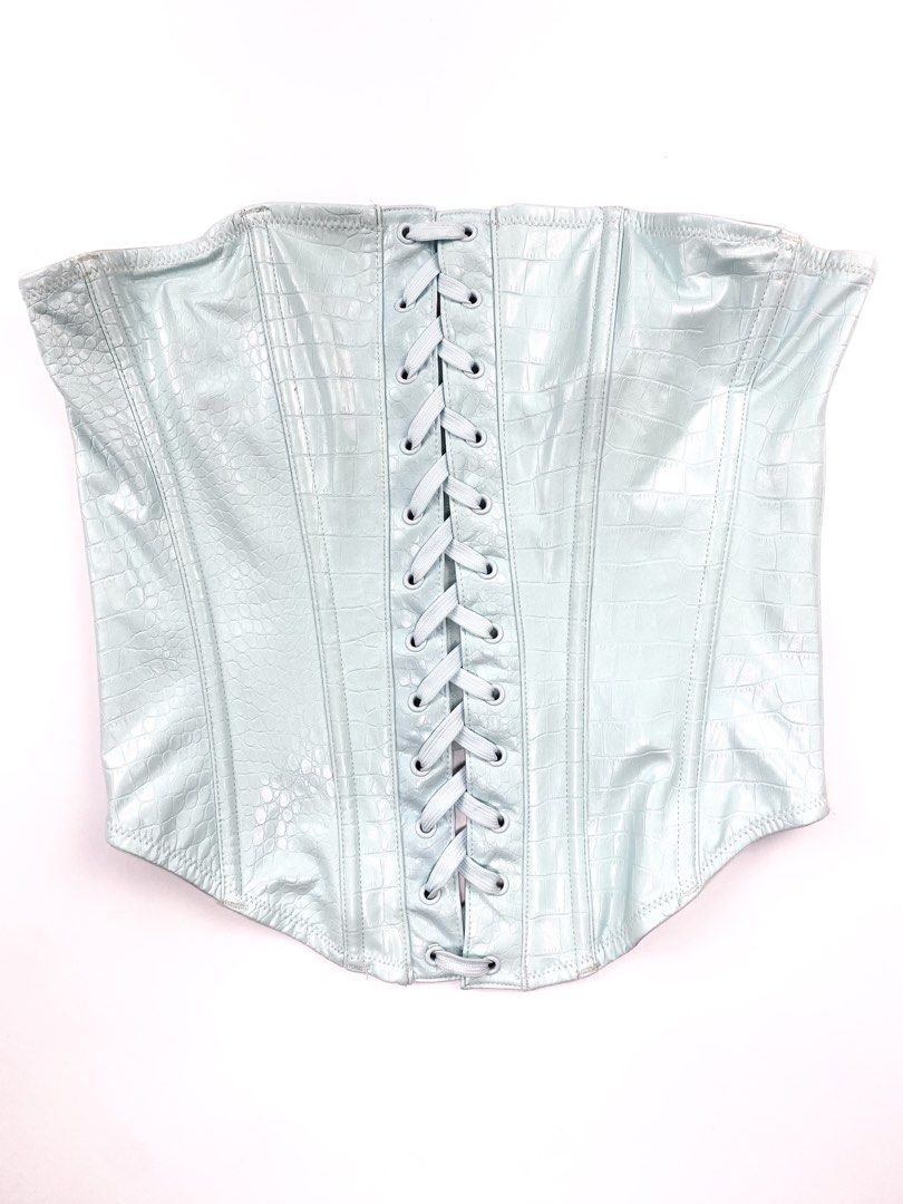 Savage X Ice Blue Croc Leather Corset (Category: Others Tops) located in Angeles City. Submitted by fruits.ph (Listing ID 1462134839, Image 2). Description: Measurements B:13.5”-15” W:11”-12.5” L:13.5” Size on Tag: ❌ Best Fit: S-M *Flat lay measurements* Mannequin Size: M (34”; 25”) Color Rate: 8/10 Flaws: light stain, barely noticeable ( See photos attached) Fabric Type: Synthetic Croc Skin/ Stretchable Fabric ***Color may vary due to lighting. 