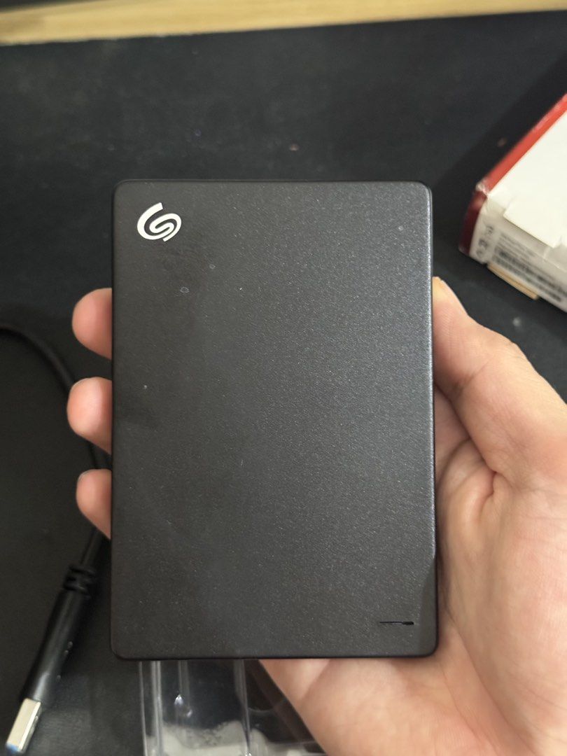 Seagate 1TB External Hard Drive (Category: Hard Disks & Thumbdrives) located in Manila. Submitted by andreiii_ (Listing ID 1462239260, Image 3). Description: Seagate 1TB External Hard Drive stocked and untested bought in orange app (not authentic) RFS: extra hard drive and just collecting dust dm for more pics and info‼️.