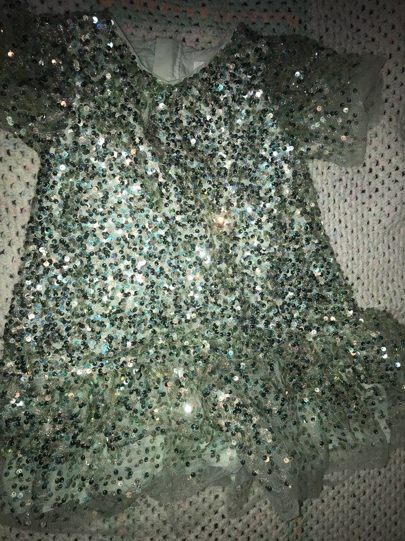 Seed Heritage Sequin Dress Size 4 (Category: Babies & Kids Fashion) located in Caloocan City. Submitted by julie_shooooopppp (Listing ID 1462176016, Image 1). Description: - Sparkly sequin dress - Brand: Seed Heritage - Color: Light blue/mint green - Size: 4 - Features: Short sleeves, ruffled hem - Perfect for parties and special occasions.