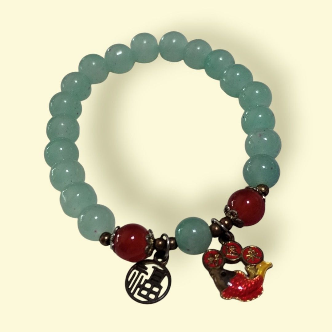 Serenity & Fortune Bracelet (Category: Bracelets) located in San Juan City. Submitted by exclusivelyours (Listing ID 1462102809, Image 2). Description: Two elegant beaded bracelets featuring glossy red and pale green gemstone-style beads, accented with decorative charms, metallic spacers, and traditional Chinese-inspired pendants that brings serenity and fortune. 🧘💰 Php1,500 - each Php2,700 - 2 pieces (1,350 each).