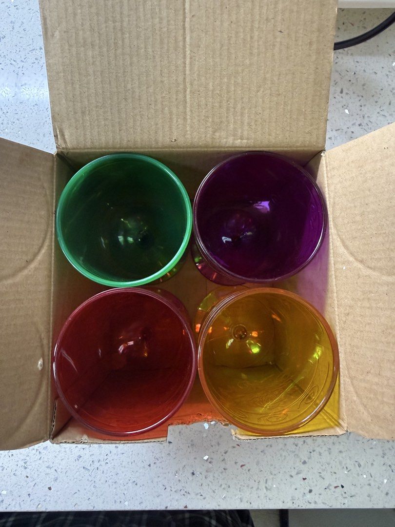 Set of 4 Colorful Plastic Goblet (Category: Dinnerware & Cutlery) located in Manila. Submitted by paulseller009 (Listing ID 1462040974, Image 1). Description: - Set of 4 plastic wine glasses - Colors: Green, Purple, Red, Orange - Green glass features a raised floral pattern - Ideal for parties and outdoor gatherings - Stackable design for convenient storage - Plastic -Brand:Avon.