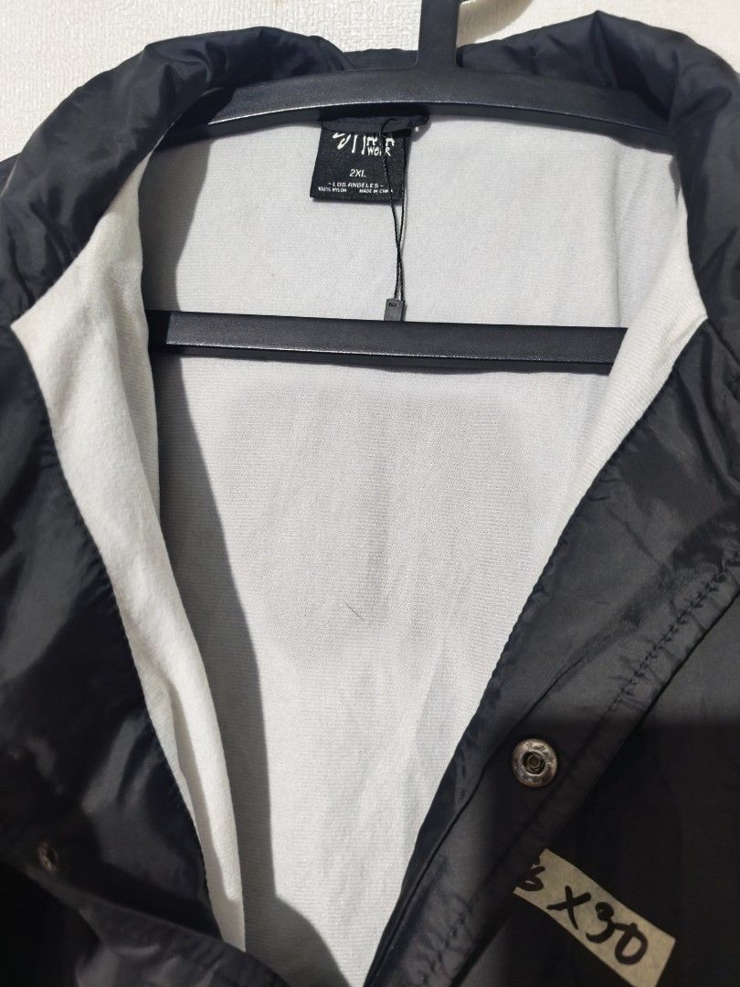 Shaka Black Coach Jacket (Category: Coats, Jackets and Outerwear) located in Pasay City. Submitted by tananoy0508061 (Listing ID 1462068478, Image 3). Description: - Black Shaka Coach Jacket - Size: 2XL - Features: Button-up front, collar, elasticated cuffs, drawstring hem - Style: Simple, classic, great for layering - Occasion: Perfect for casual wear.
