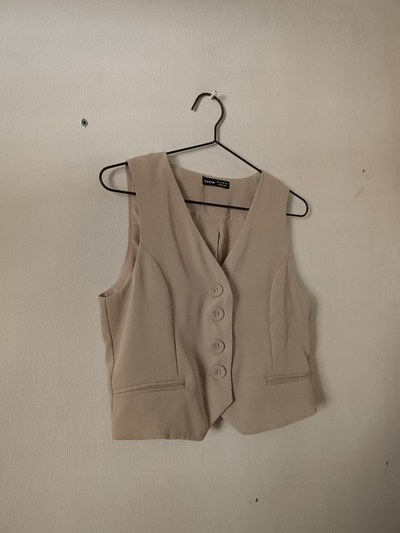 SHEIN Beige Button-Up Sleeveless Vest (Category: Sleeveless) located in Manila. Submitted by shajanina.14 (Listing ID 1462126759, Image 2). Description: SHEIN Preloved As good as new Extra Small- US As per measuring tape, Bust- up to 34 inches Waist- up to 32 inches Length- 18 inches.