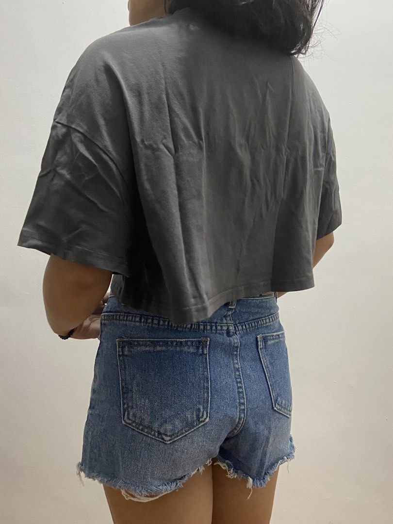 SHEIN Graphic Oversized Crop Top (Category: Shirts) located in Quezon City. Submitted by marie_qlo (Listing ID 1462079677, Image 2). Description: - Fabric: Cotton jersey - Style: Oversized boxy crop top, drop-shoulder fit, raw/unfinished crop hem, black graphic print - Condition: Good - Flaws: Preloved but not abused, slight staining at the back - Originally bought for PHP 550 Measurements (flat lay, may vary 1-2cm): - Bust: 92 cm - Length: 46 cm