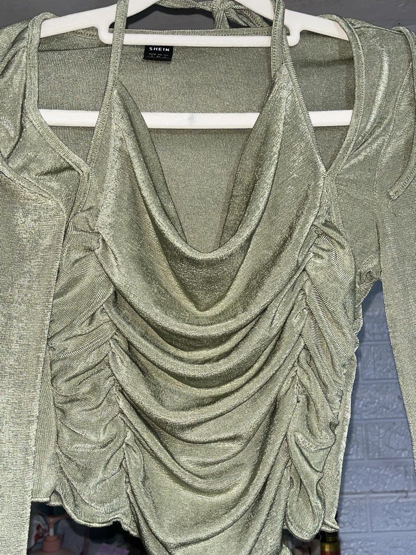 SHEIN tie back lettuce sleeve (Category: Others Tops) located in Quezon City. Submitted by akikekoku (Listing ID 1462194468, Image 3). Description: - Army green crop top from SHEIN - Features a ruched front and elegant bell sleeves - Halter neck with tie-back closure - Fabric has a subtle shimmer - Small on tag #SHEIN #Ruched #Lettuce #Partyfit.