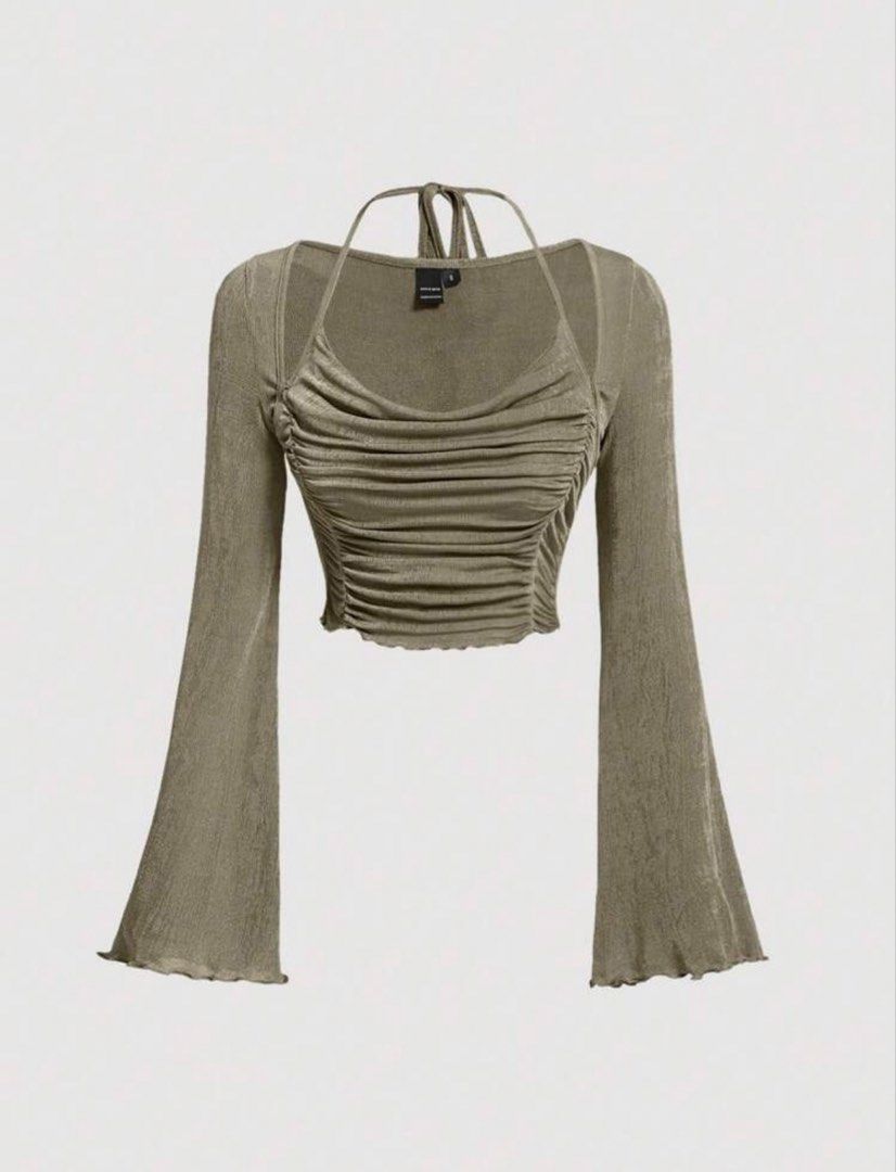 SHEIN tie back lettuce sleeve (Category: Others Tops) located in Quezon City. Submitted by akikekoku (Listing ID 1462194468, Image 1). Description: - Army green crop top from SHEIN - Features a ruched front and elegant bell sleeves - Halter neck with tie-back closure - Fabric has a subtle shimmer - Small on tag #SHEIN #Ruched #Lettuce #Partyfit.