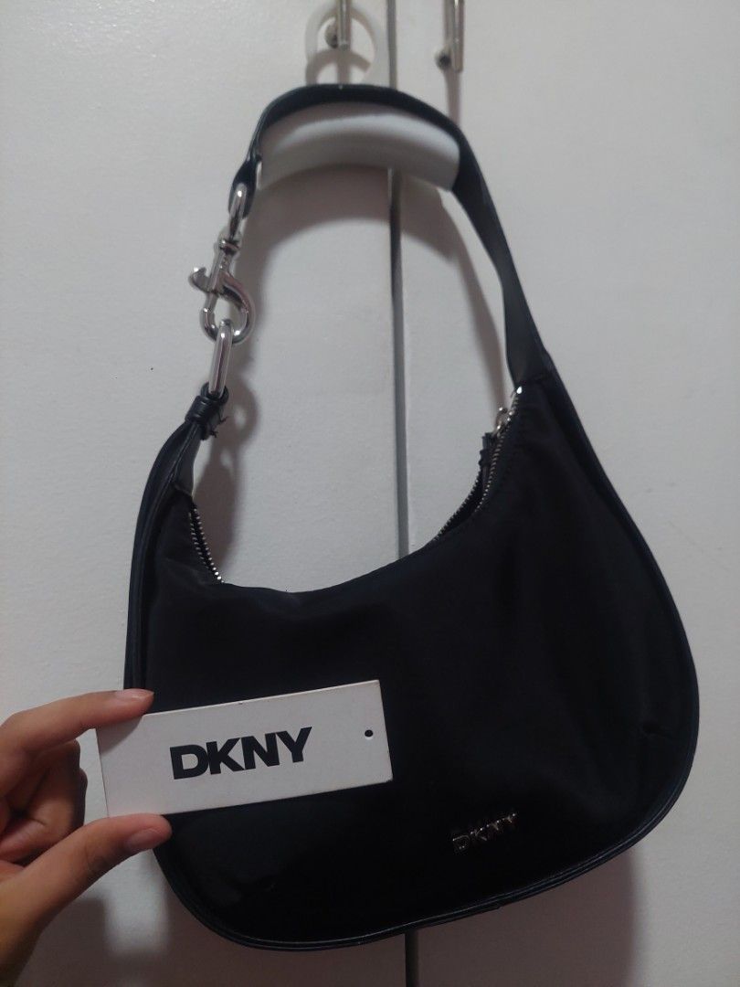 Shoulder bag/ Hobo bag/ Kili bag (Category: Shoulder Bags) located in Valenzuela. Submitted by joliyanaa (Listing ID 1462185031, Image 2). Description: - Brand: DKNY - Style: Shoulder Bag / Hobo Bag / Kili Bag - Color: Black - Condition: Well used with tag - Material: Quality fabric - Features: Versatile design, authentic branding - Location: Valenzuela City.